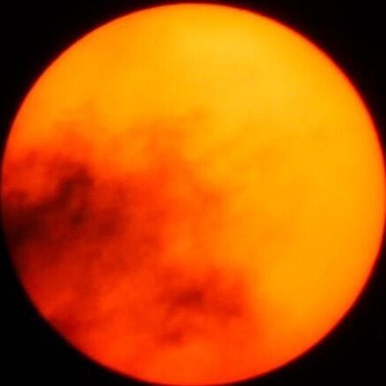 Orange Moon in Dark Night Sky